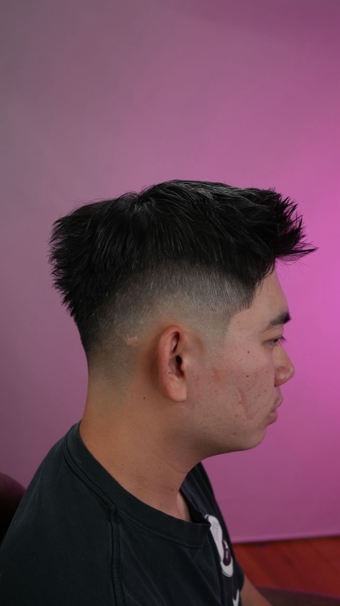 Mid skin fade with spiky textured top